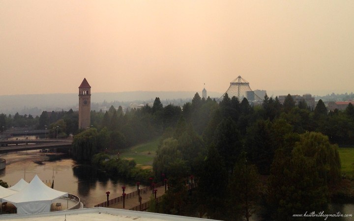 The skyline of Spokane tinted with ash from wildfires.