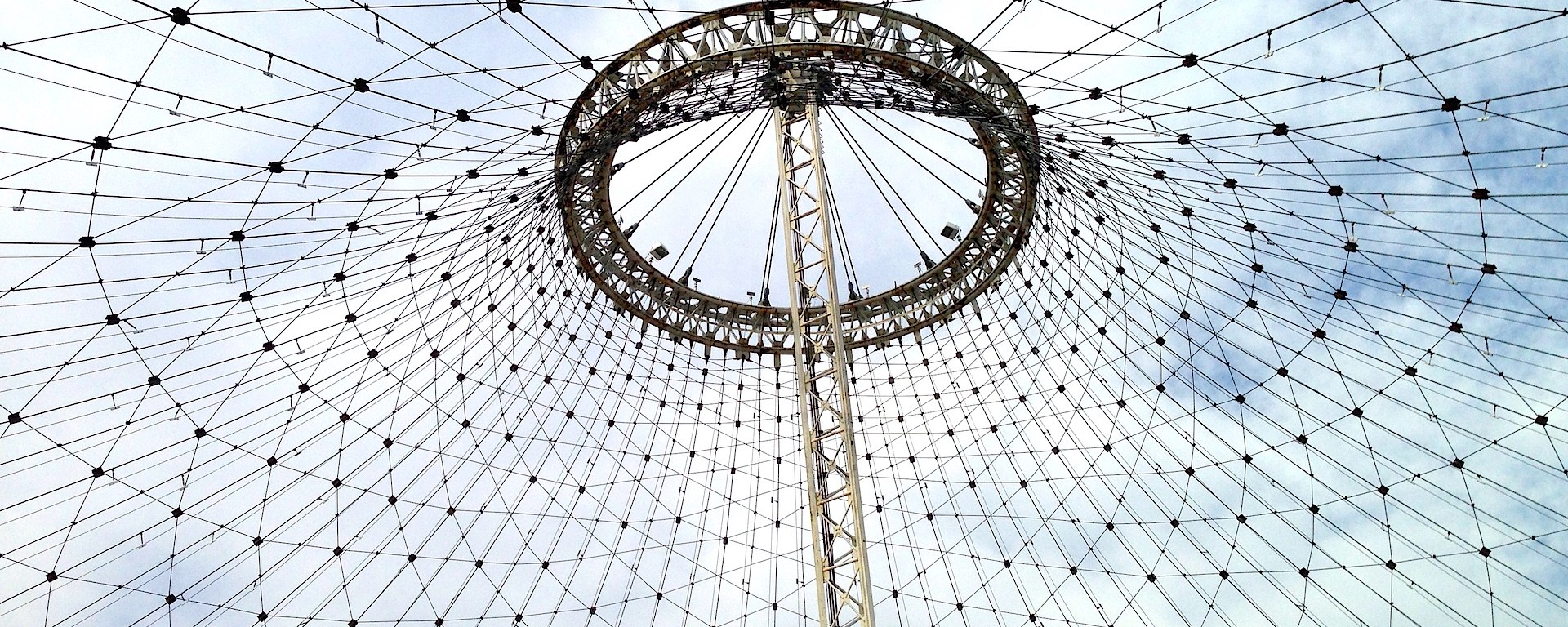 A blue sky peeks out above the Pavilion, a remnant of the World's Fair.