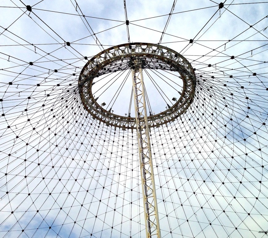 A blue sky peeks out above the Pavilion, a remnant of the World's Fair.